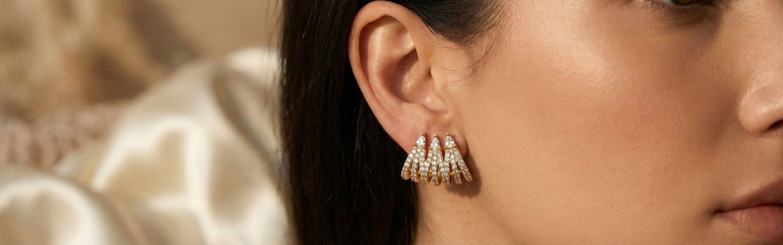 18k gold-filled stud earrings, gold color and zircon, closeup shot on a model